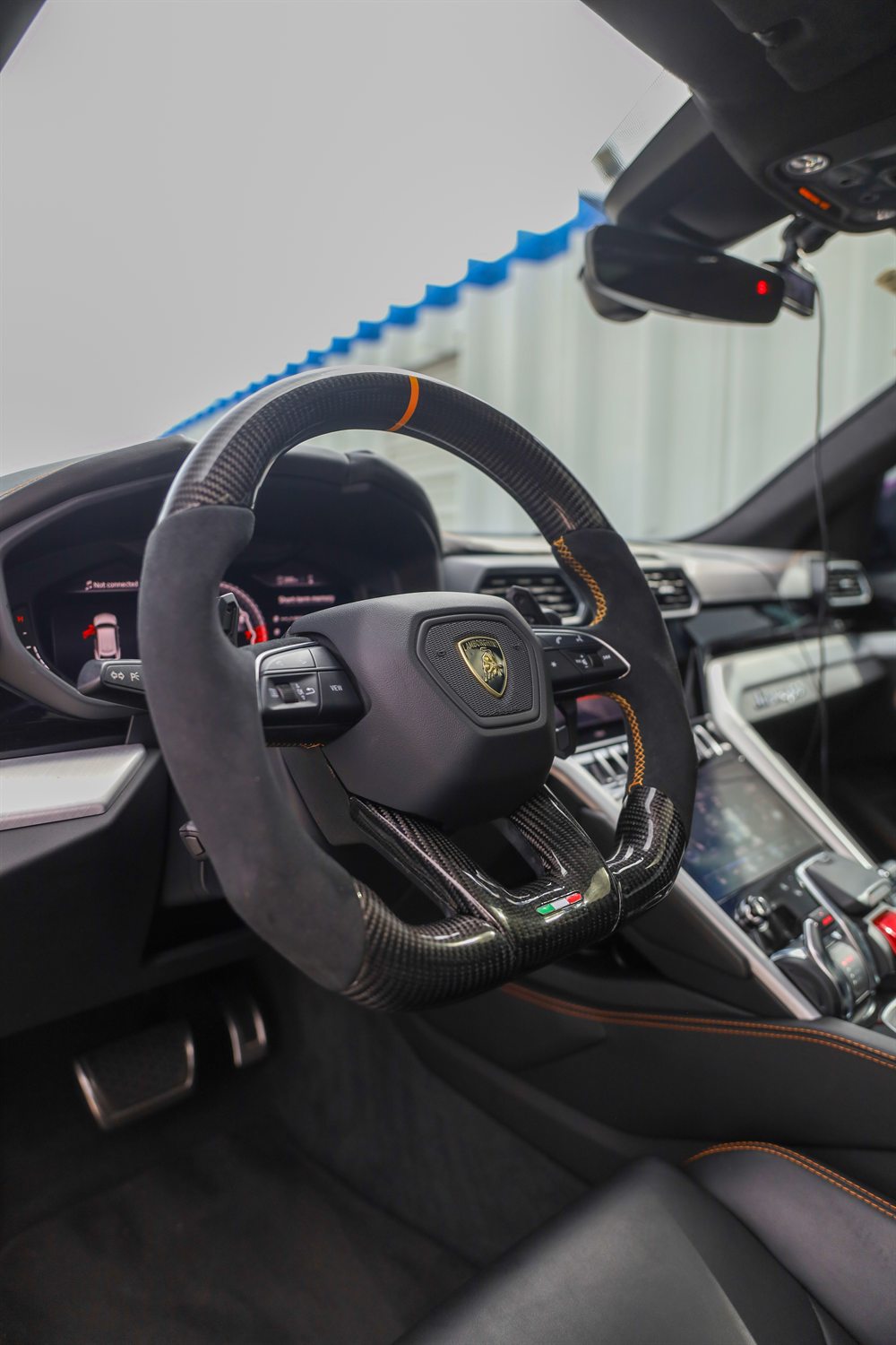 Alcantara and carbon steering wheel in a Lamborghini
