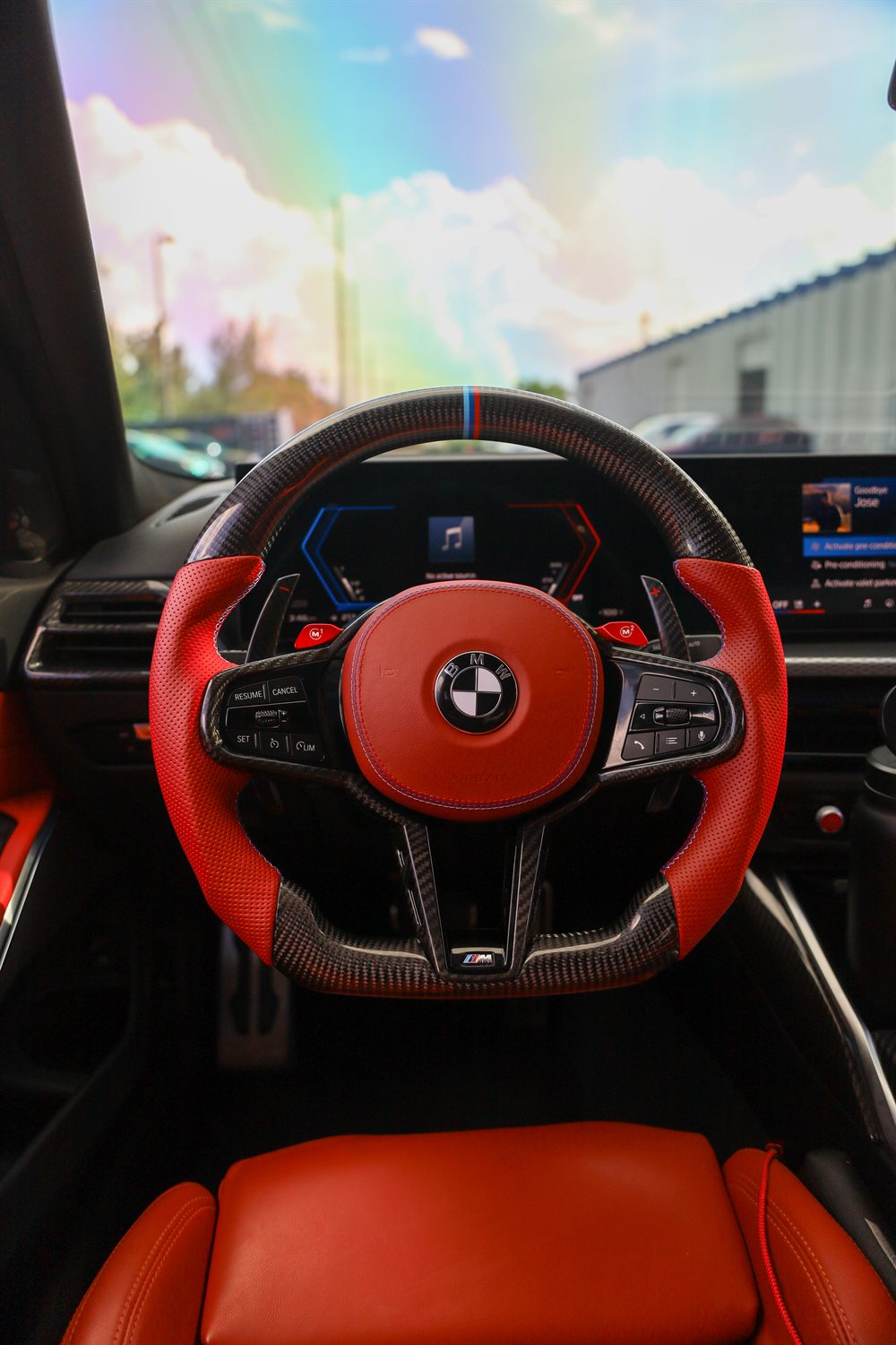 Custom carbon fiber steering wheel fitted in a BMW M