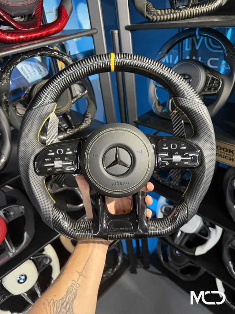Black perforated leather, Gloss carbon, Yellow centerline Mercedes AMG steering wheel by Miami Carbon Designs