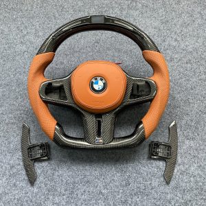 BMW G series custom carbon fiber steering wheel in cognac perforated leather with LED display and carbon paddles by Miami Carbon Designs