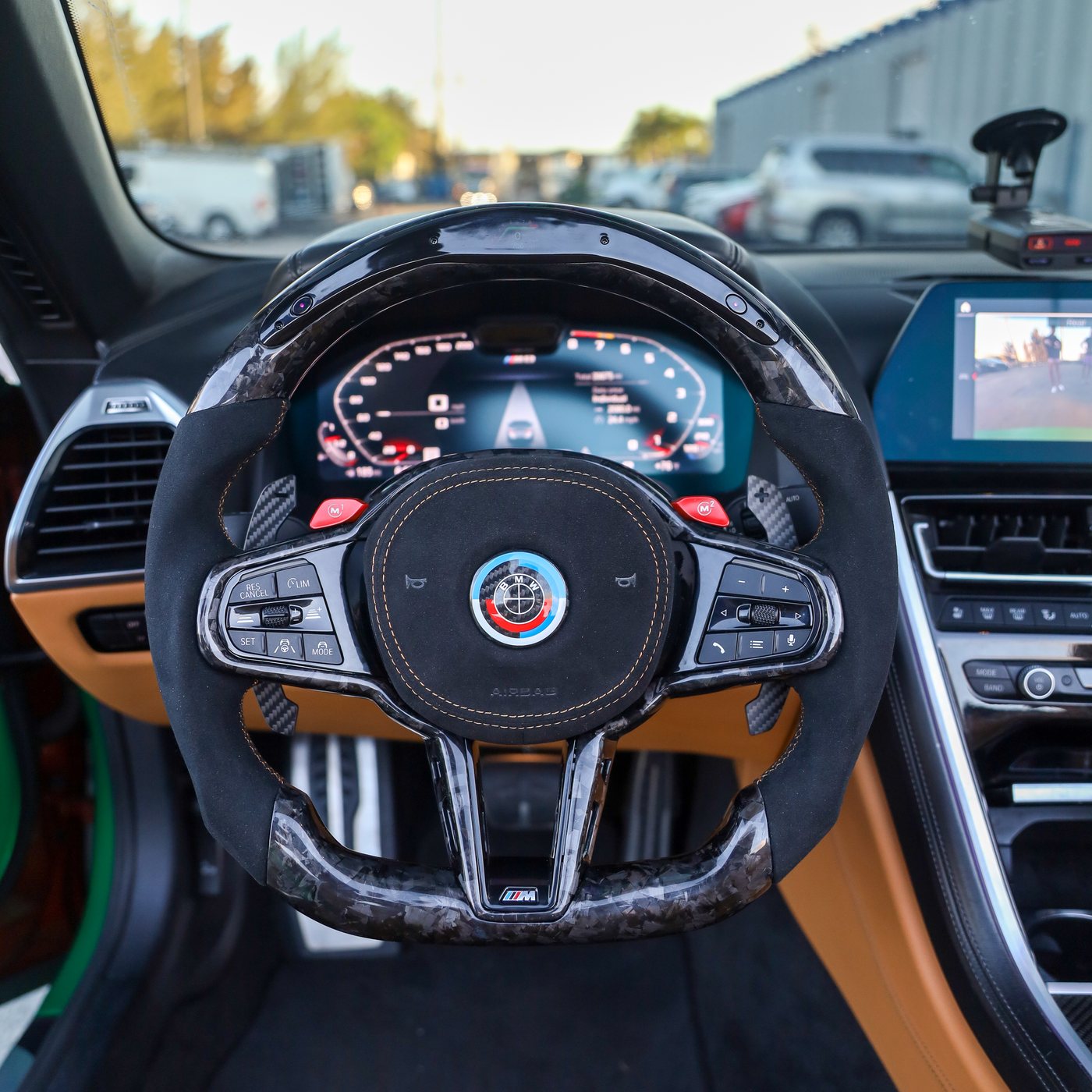 BMW M8 custom forged carbon fiber steering wheel with black Alcantara, tan stitching and LED display, installed, by Miami Carbon Designs