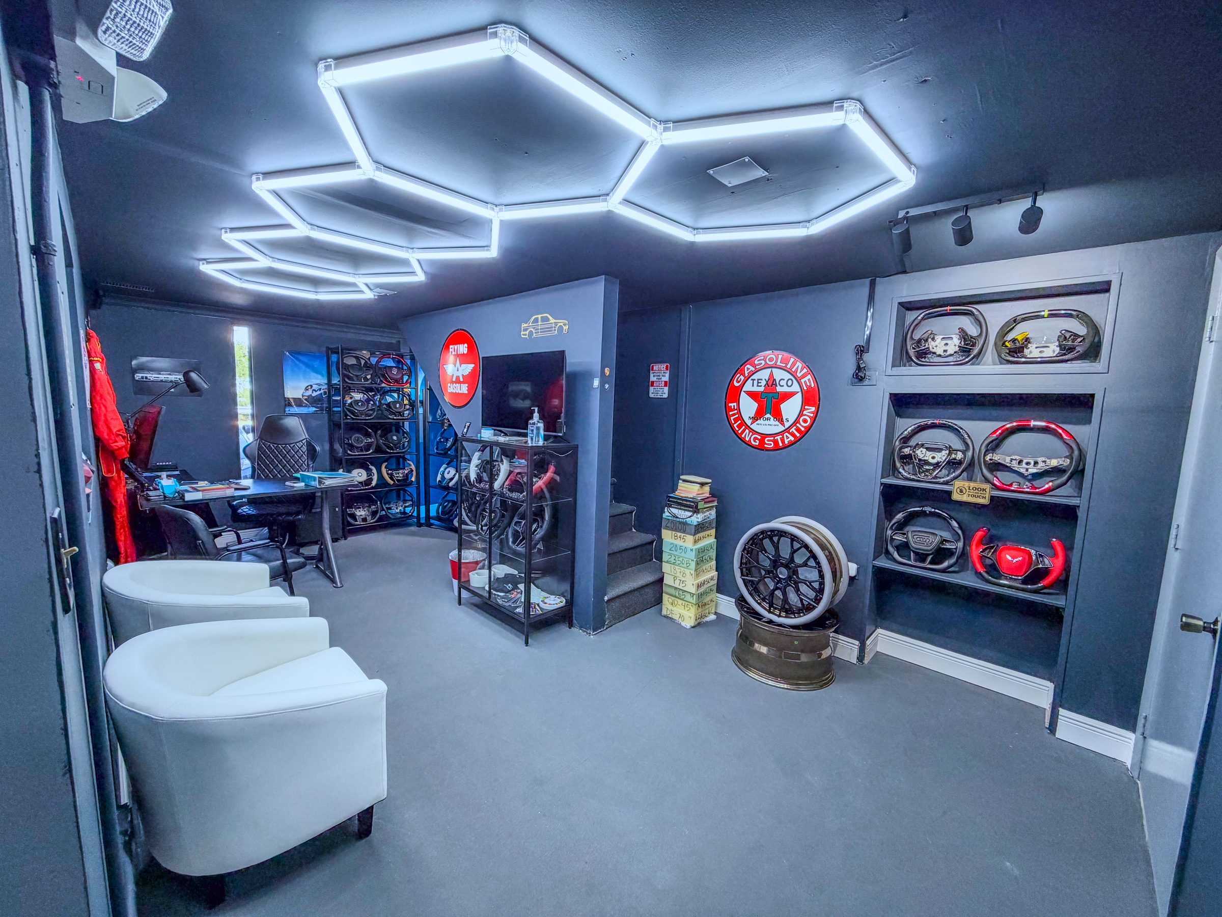 Miami Carbon Designs showroom in Miami with custom carbon fiber steering wheels on display