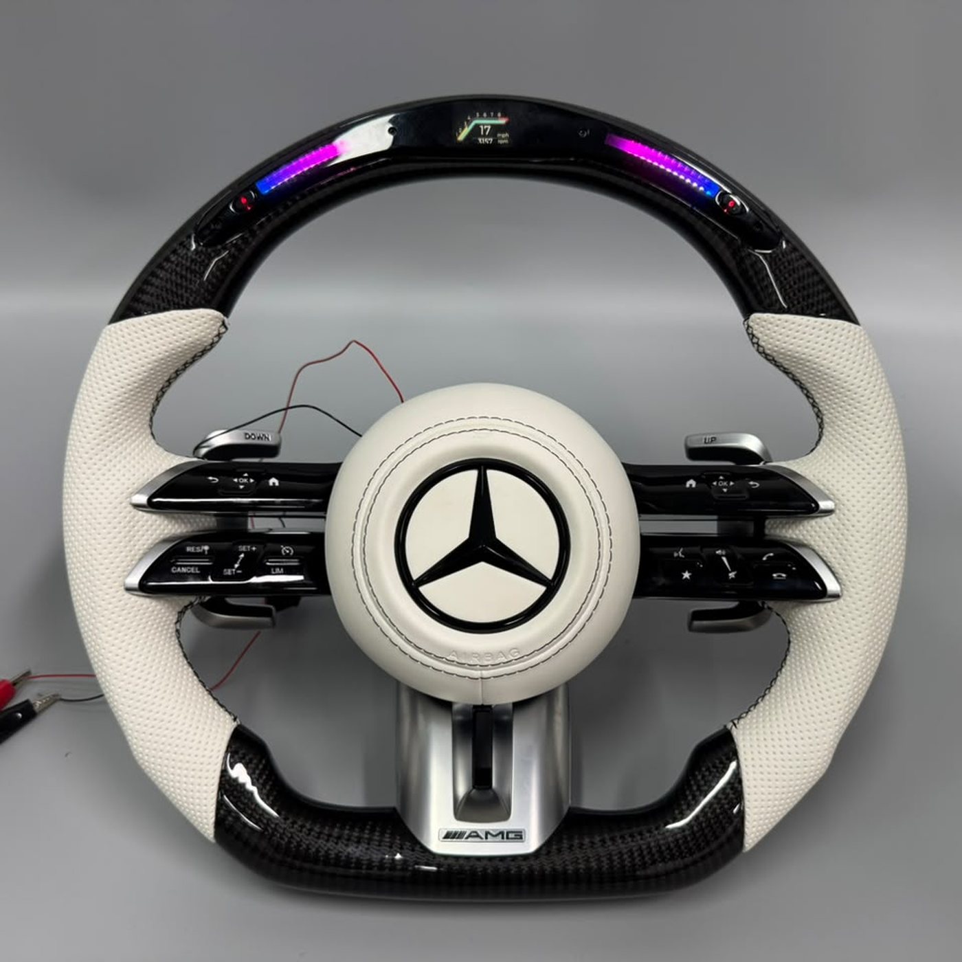 Mercedes AMG 2024 custom gloss carbon fiber steering wheel in white perforated leather with LED display by Miami Carbon Designs