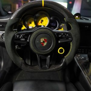 Porsche 991 Turbo S custom gloss carbon fiber and Alcantara steering wheel with yellow centerline, installed, by Miami Carbon Designs