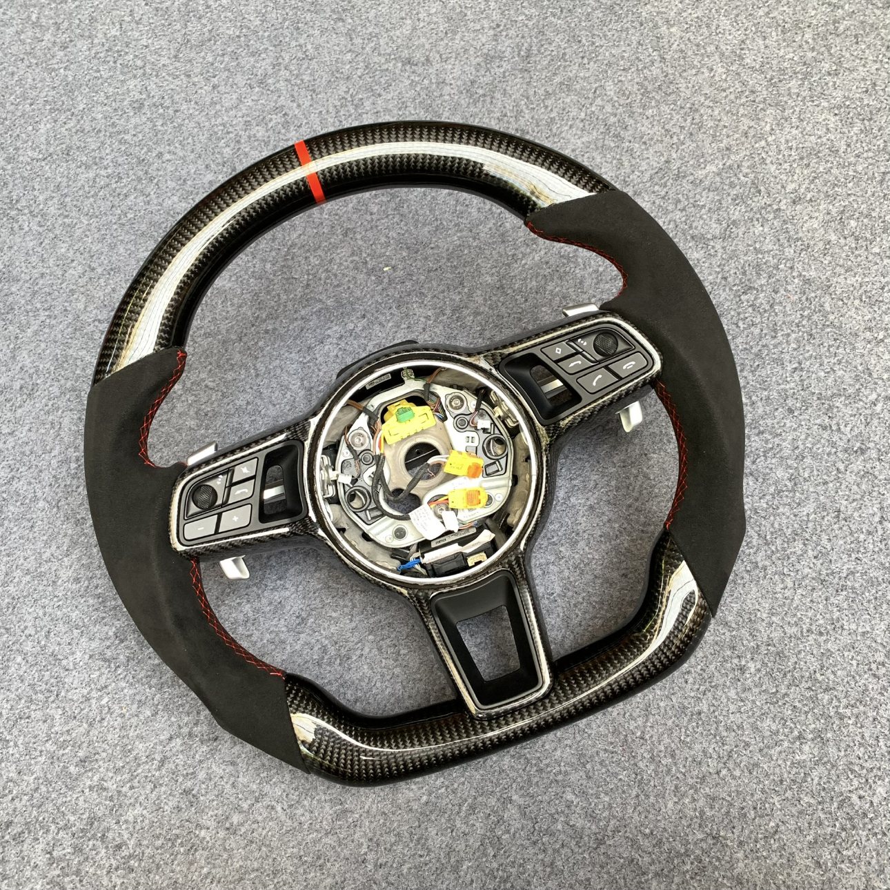 Porsche 992 custom gloss carbon fiber steering wheel with black Alcantara, red centerline and red stitching by Miami Carbon Designs