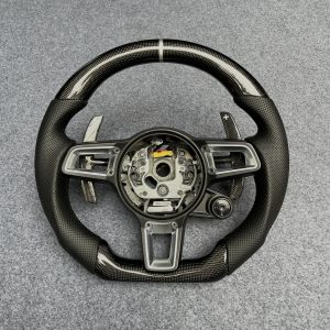 Porsche 992 custom gloss carbon fiber steering wheel with black perforated leather, silver centerline and carbon paddles by Miami Carbon Designs