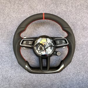 Porsche 992 custom steering wheel in black perforated leather with red centerline and gloss carbon fiber bottom by Miami Carbon Designs